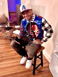 a man sitting on a stool