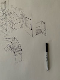 a sketch of a room with furniture and a marker