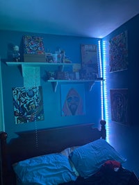 a bed in a room with blue lights