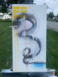 a painting of a snake on a easel